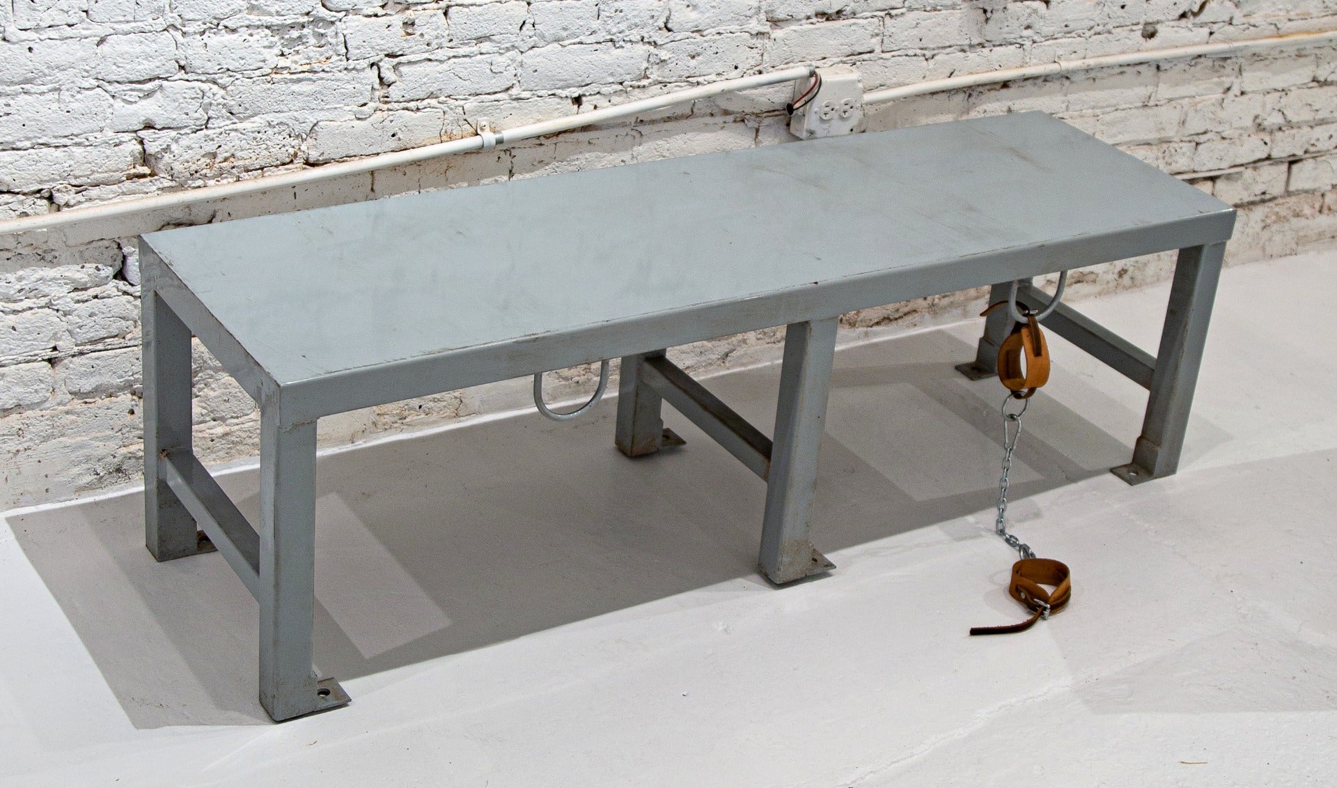 heavy duty all-welded joint heavy gauge steel cook county jail bench with integrated rings for handcuffs