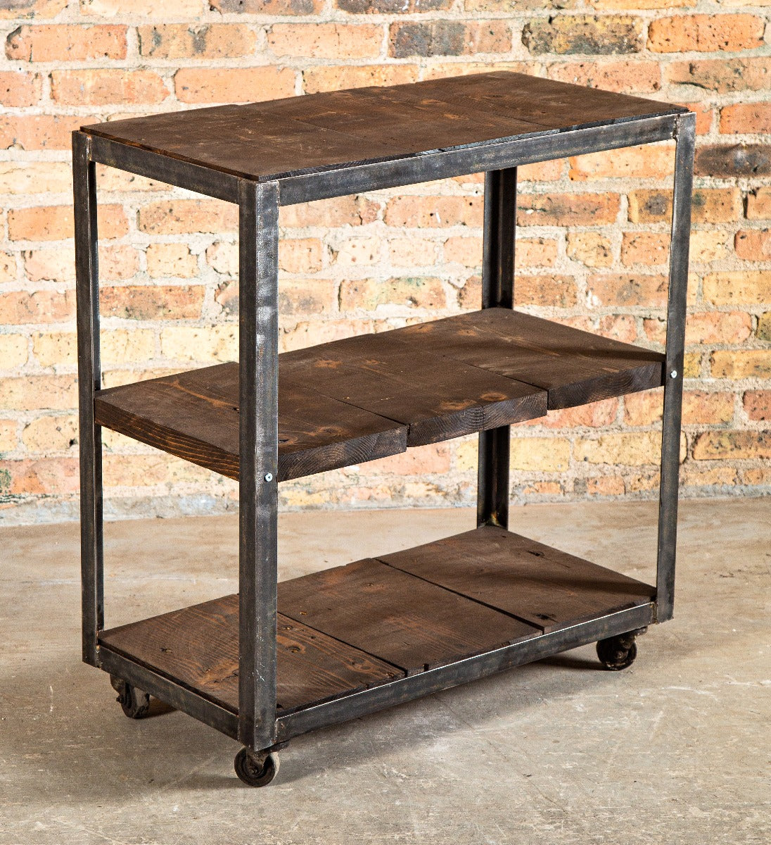 vintage american industrial chicago three-tier mobile factory workshop cart with darkly stained pine wood shelves
