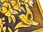 19th century salvaged figural 6 x 6 fireplace tile featuring floral designs and winged bird with rich olive glazed finish