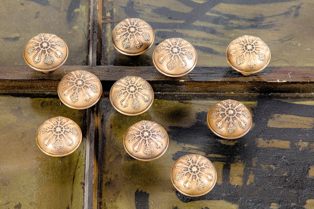 large lot of original late 19th or early 20th century antique american dome-shaped wrought brass doorknobs