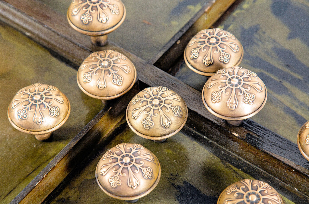 large lot of original late 19th or early 20th century antique american dome-shaped wrought brass doorknobs