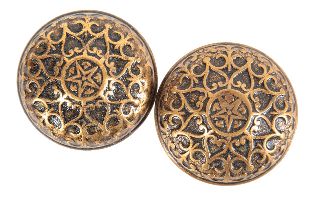 matching set of 1870s ornamental cast bronze patented mallory wheeler doorknobs with centrally located stars