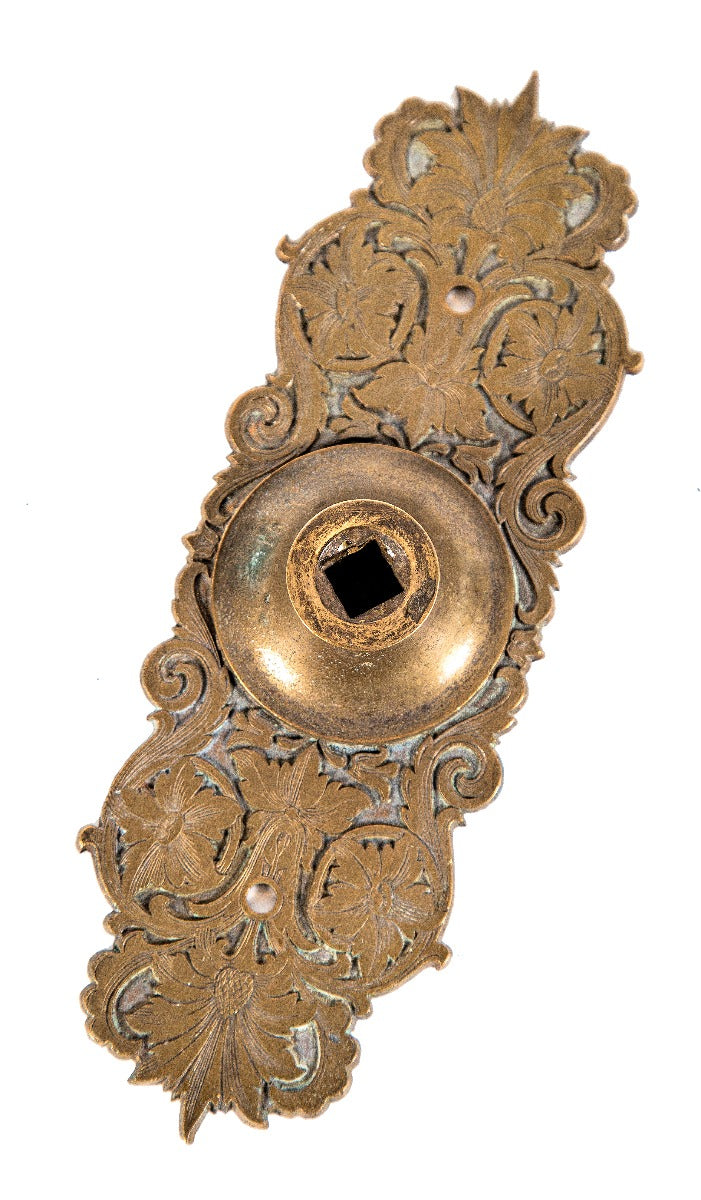 seldom found 1870's original and nicely patinated "compression cast" residential bronze metal exterior residential doorbell pull backplate or escutcheon
