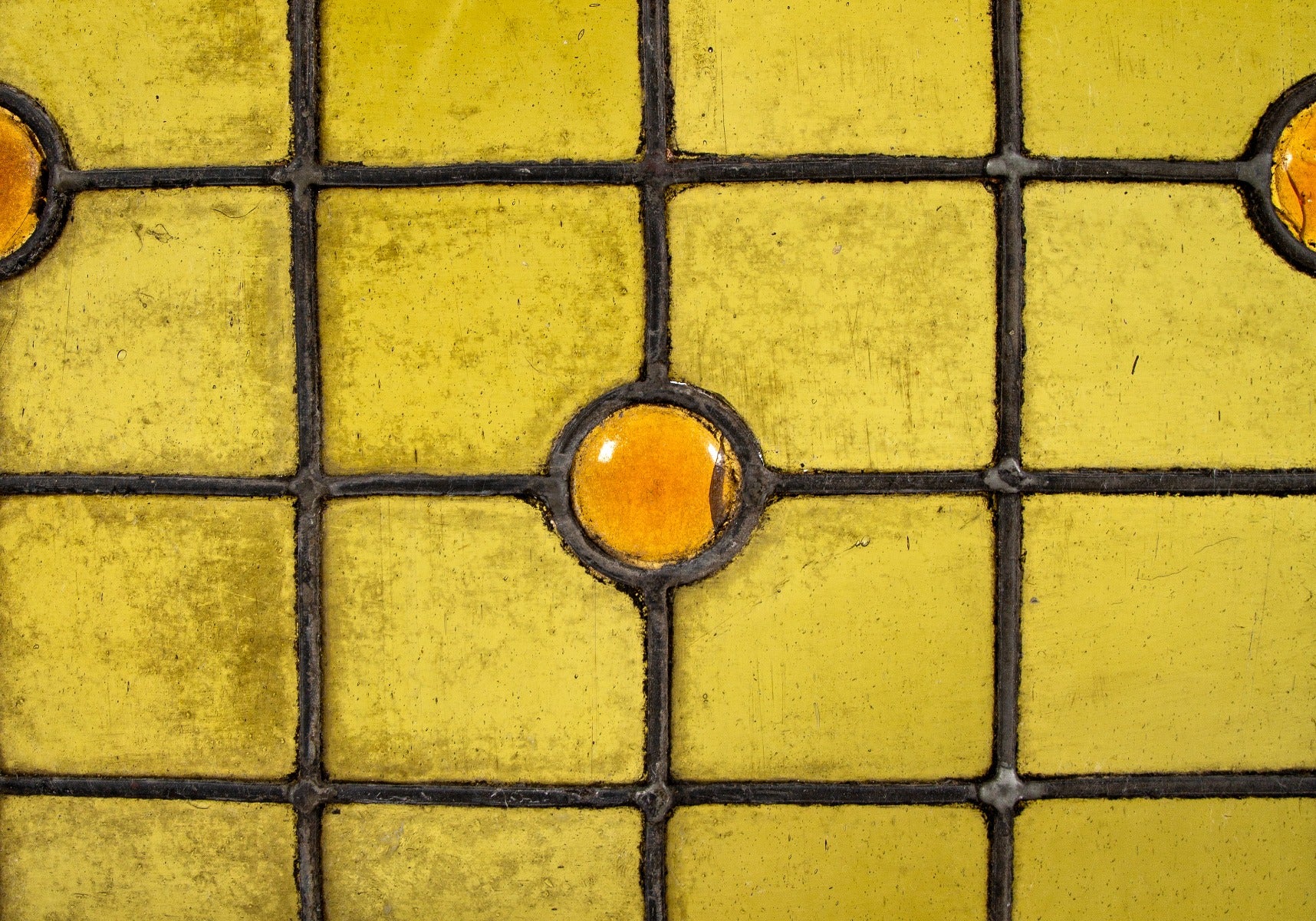 diminutive 1880's salvaged chicago richly colored residential stained glass window accentuated with amber rondels