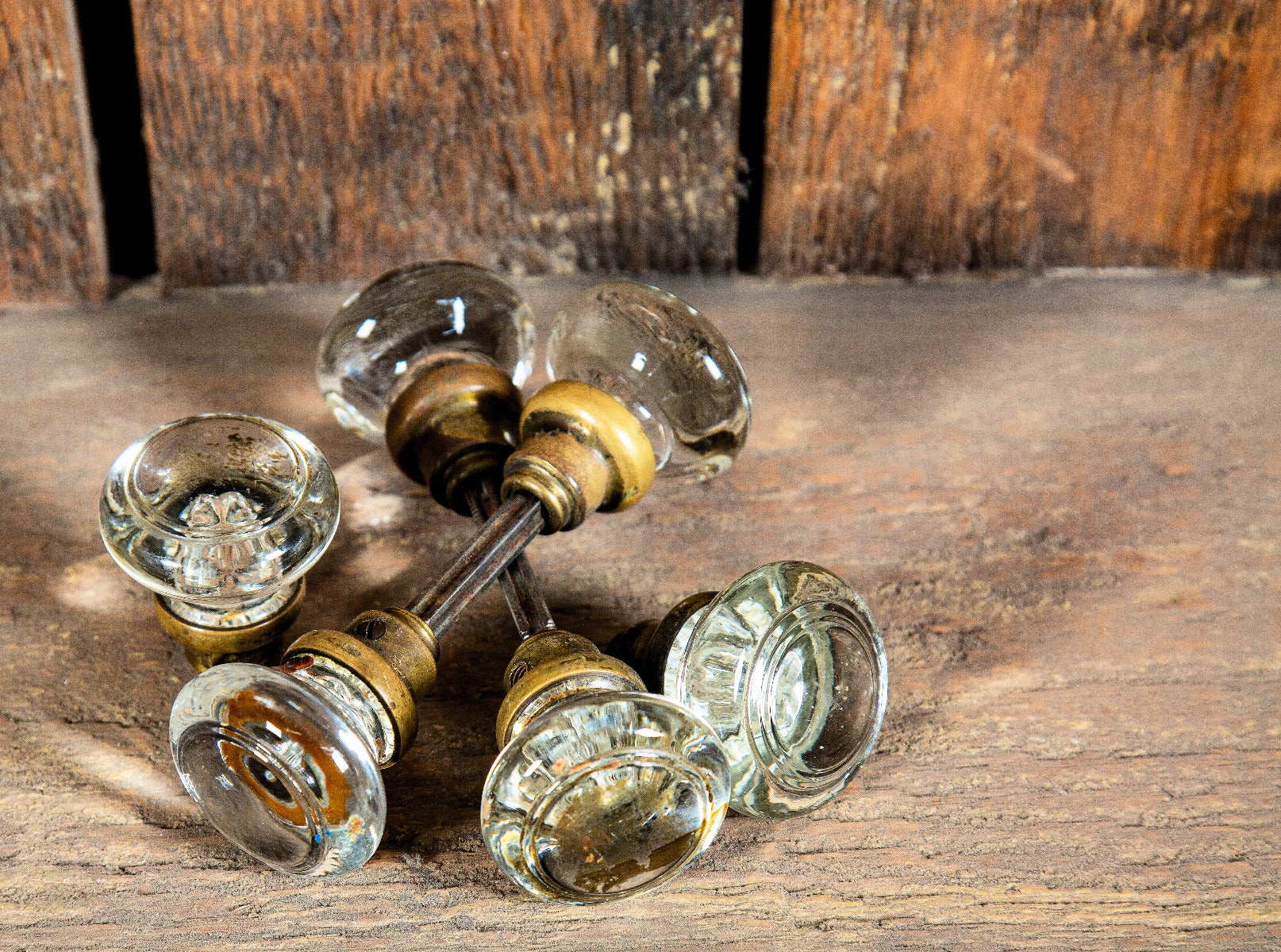 group of matching rounded-shaped antique american salvaged chicago glass doorknobs dating to early 20th century