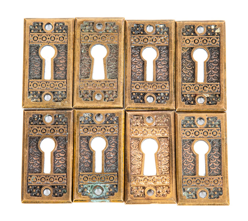 group of 8 matching highly desirable 19th century "brocade" pattern interior residential passage door keyplates