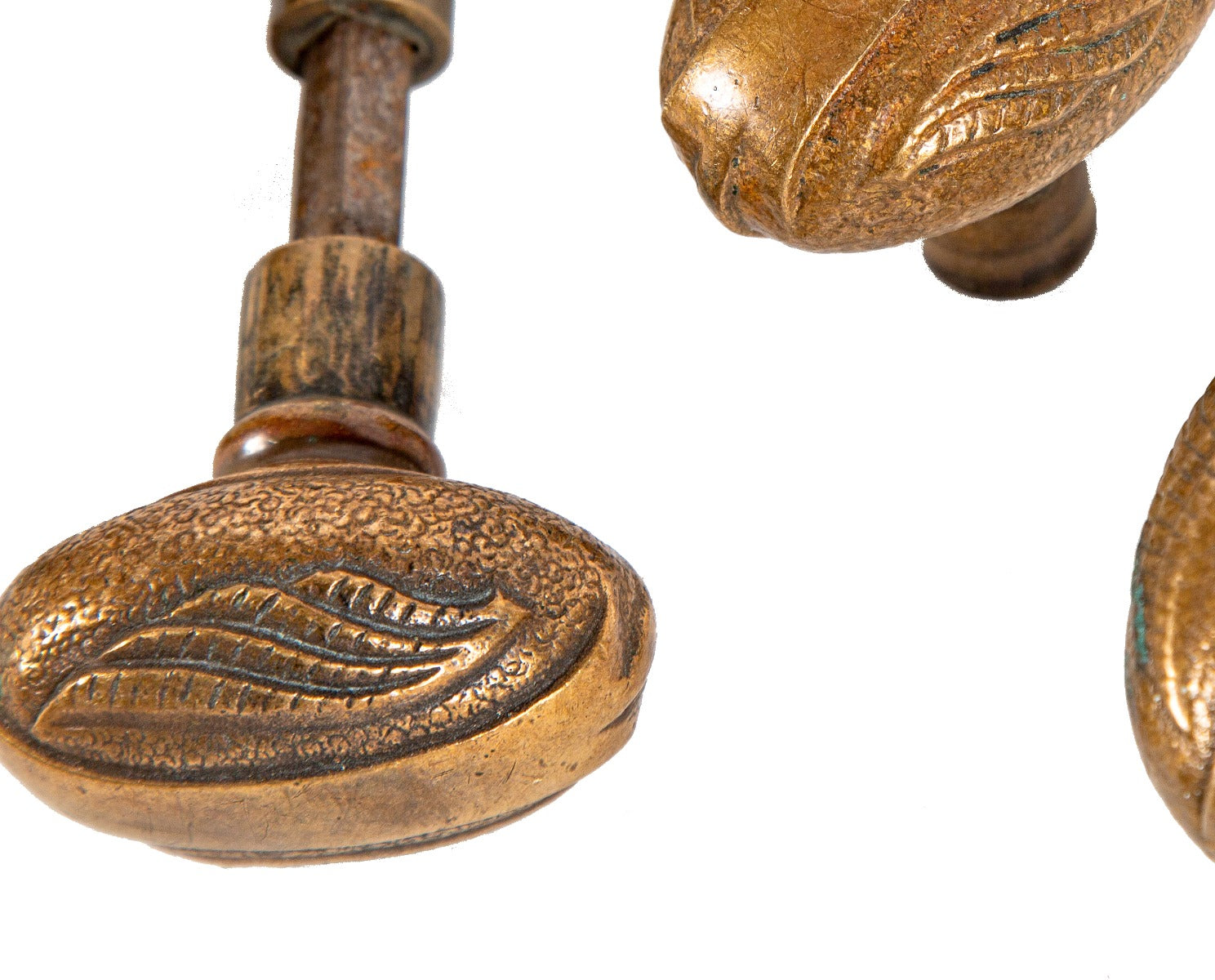 group of five matching late 19th century oval-shaped passage size cast bronze f.c. linde doorknobs with nicely aged surface patina