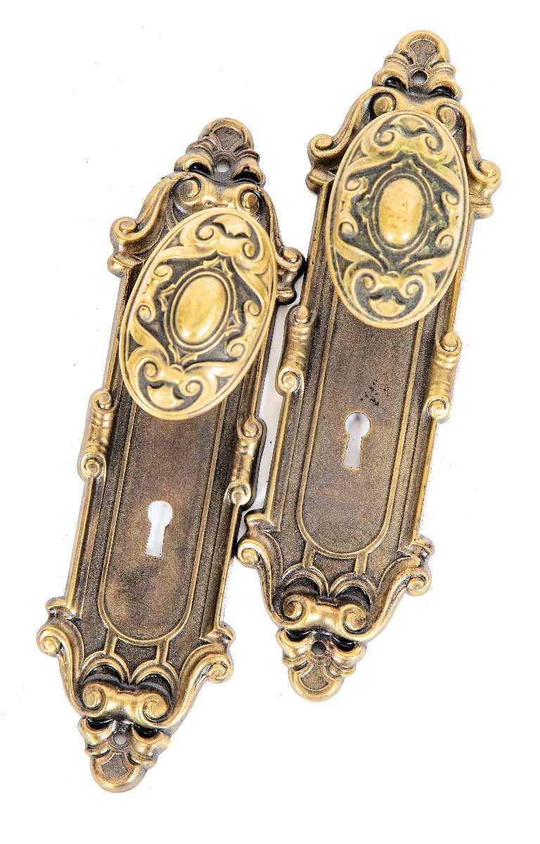 early 20th century antique american salvaged chicago "meridian" pattern wrought brass residential doorknobs and matching backplates