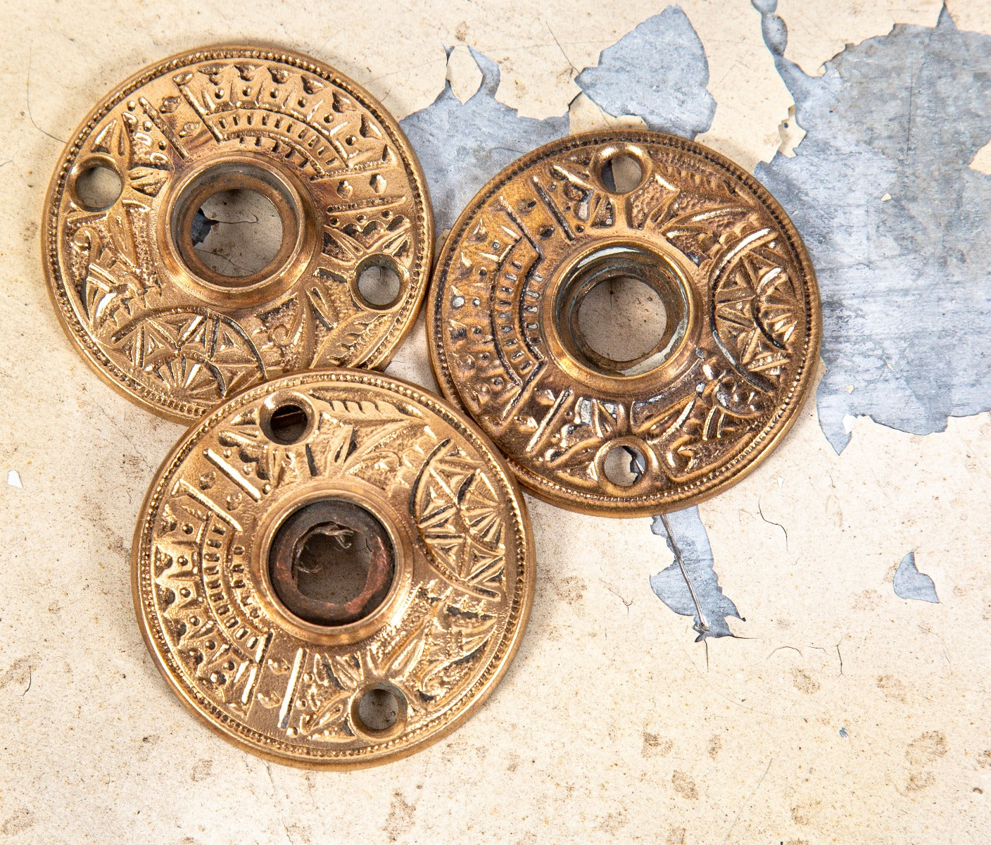 three matching original ornamental cast brass 1880s eastlake style "oriental" pattern passage door rosettes by branford lock works