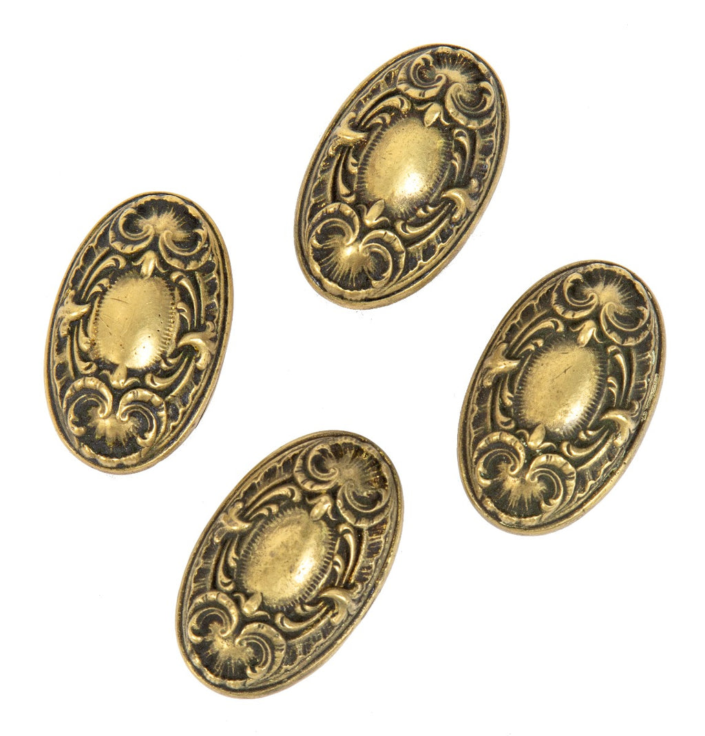group of four matching ornamental cast brass salvaged chicago yale & towne "navarro" pattern doorknobs