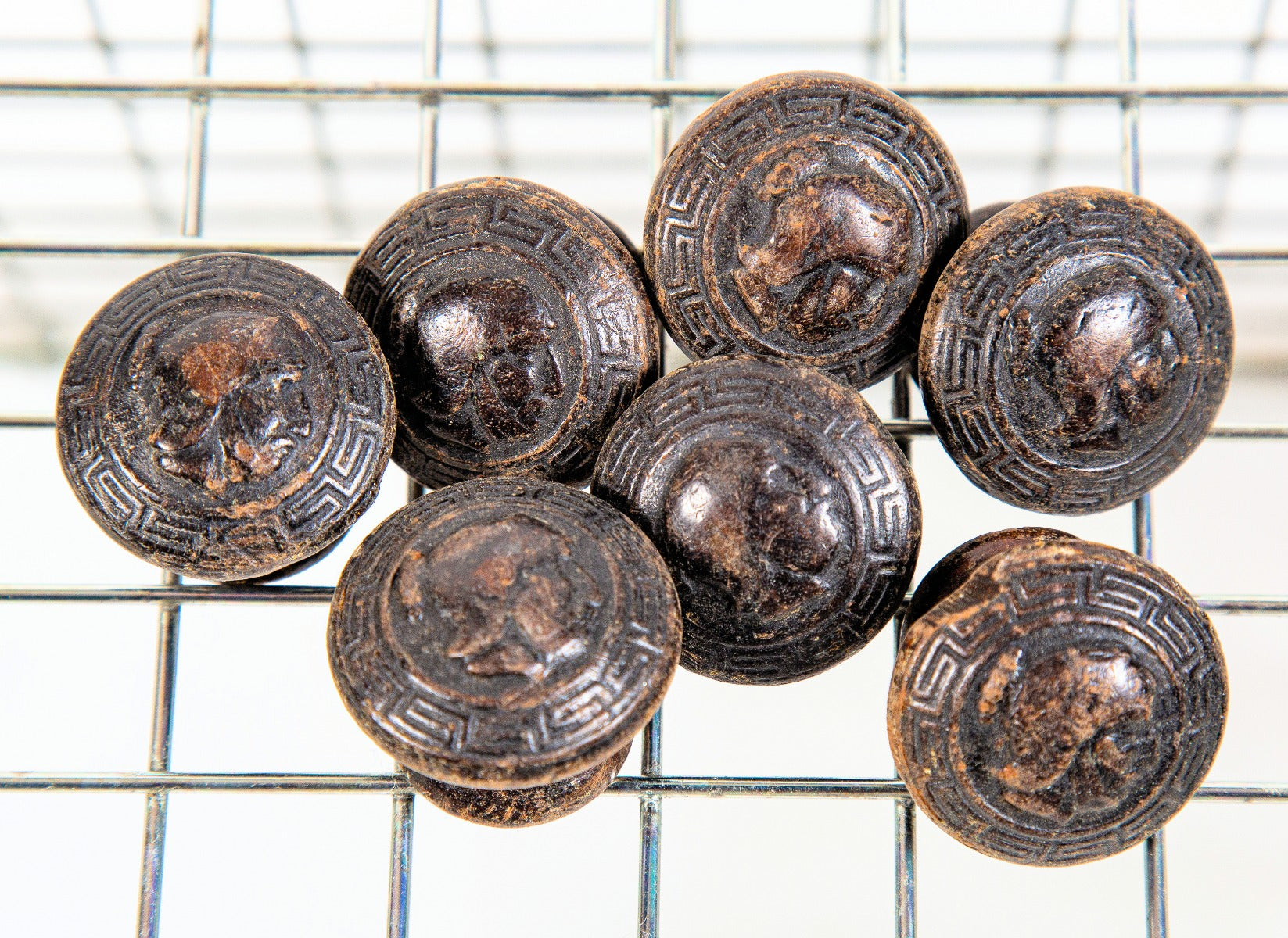 rare 19th century pressed ornamental diminutive walnut wood figural soldier cabinet drawer pulls with nicely aged finish and neogrec border