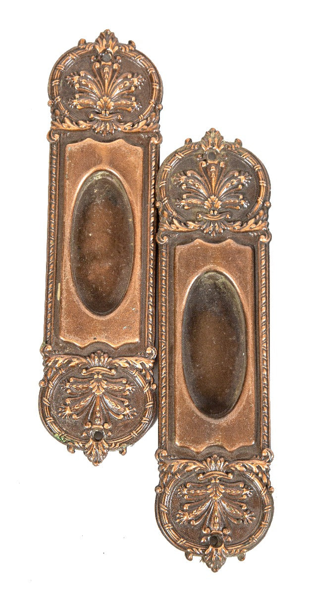 matching set of original ornamental wrought bronze interior residential pocket door backplates with nicely aged surface patina