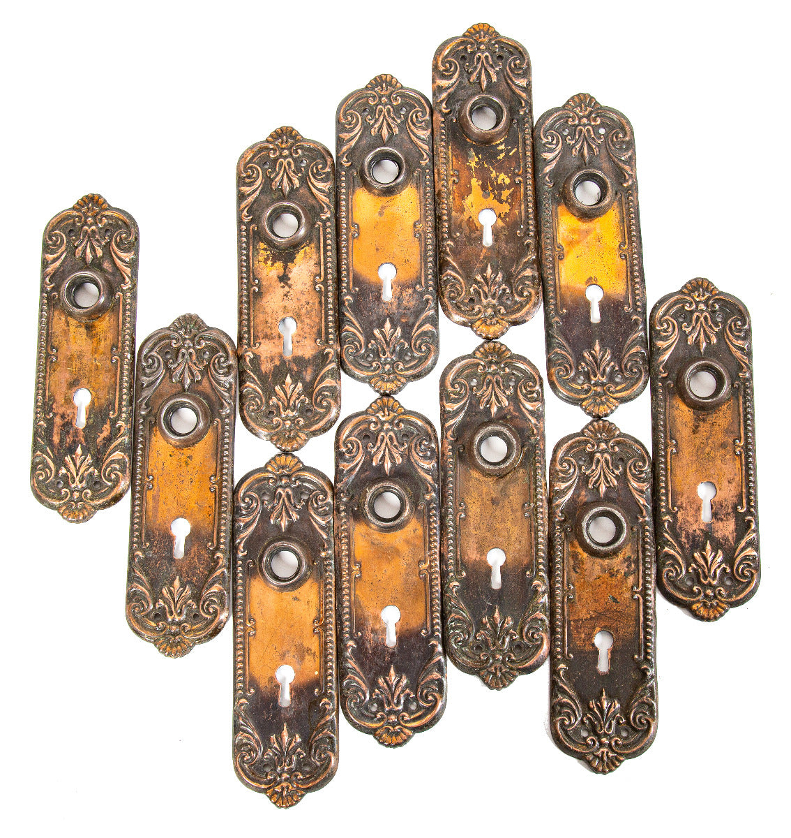 large lot of matching early 20th century salvaged milwaukee copper-plated stamped steel doorknob backplates