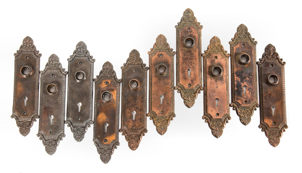 large lot of early 20th century ornamental cast iron "geneva" pattern interior residential doorknob backplates