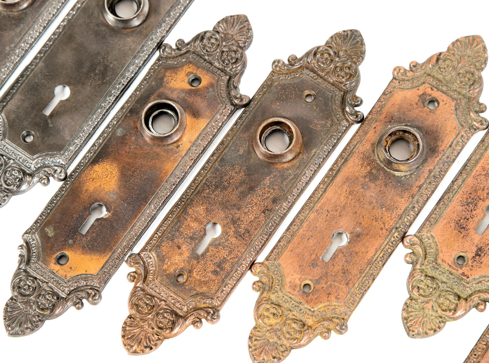 large lot of early 20th century ornamental cast iron "geneva" pattern interior residential doorknob backplates