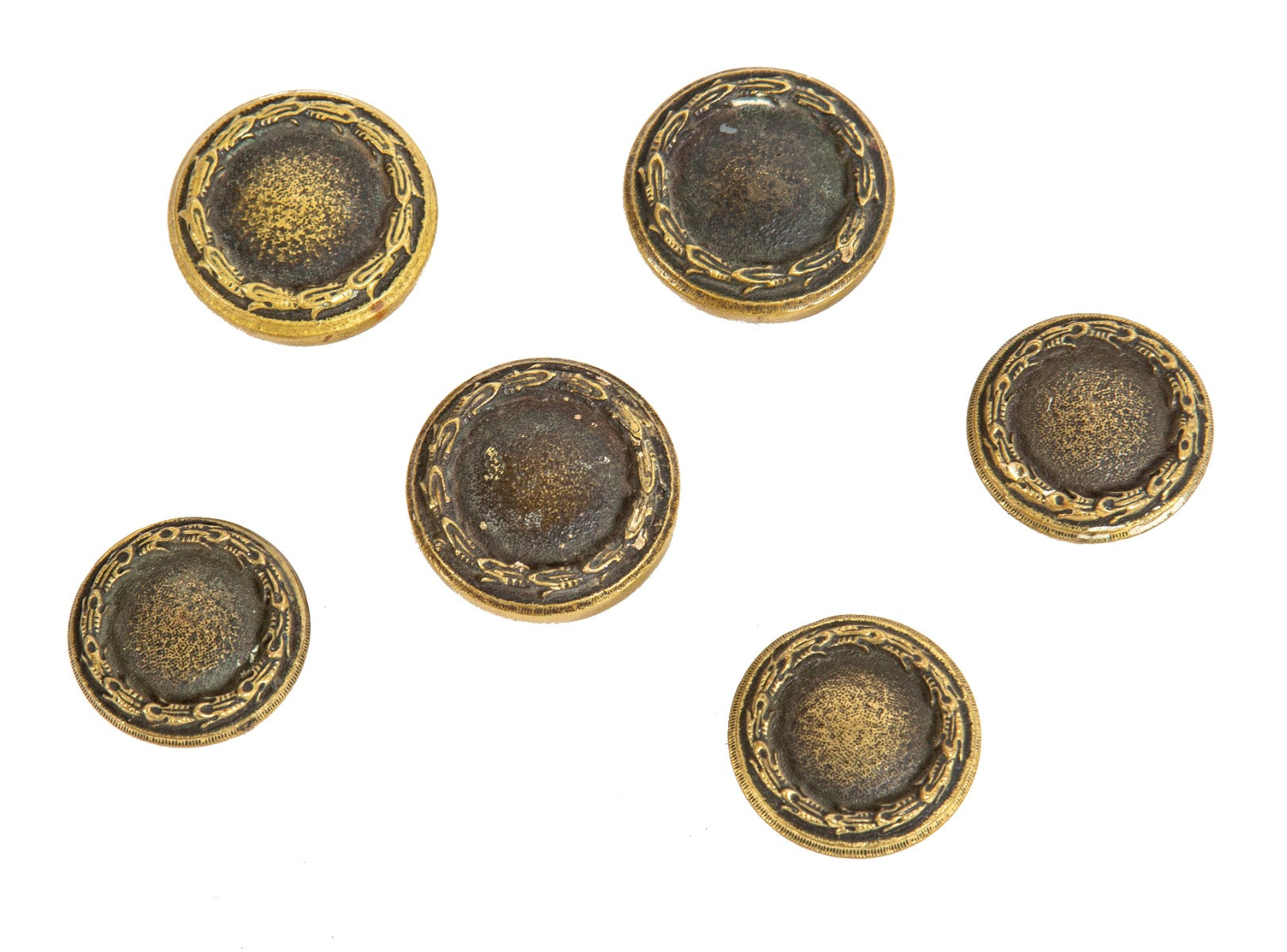 group of early 20th century heavy cast brass salvaged chicago apartment building doorknobs accentuated with bayleaf borders