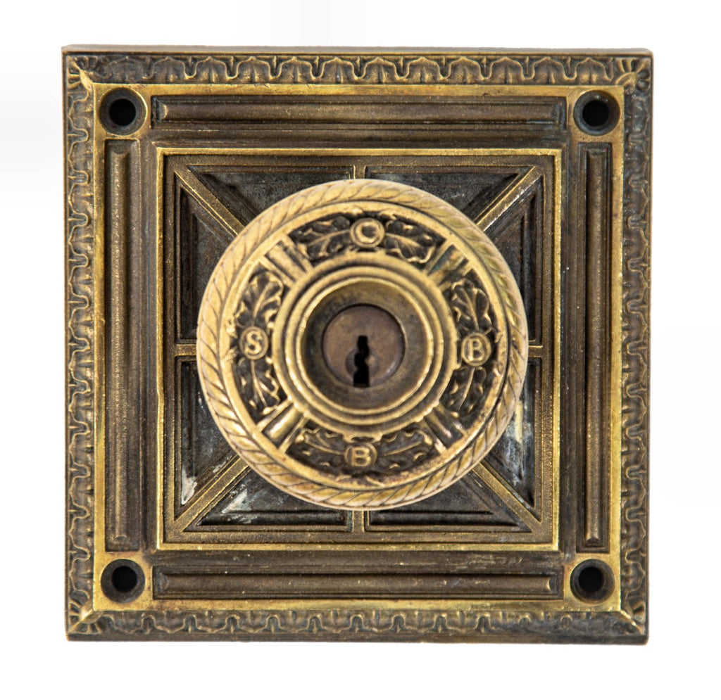 original oversized holabird and roche-designed ornamental cast brass chicago savings bank building monogrammed doorknob and backplate