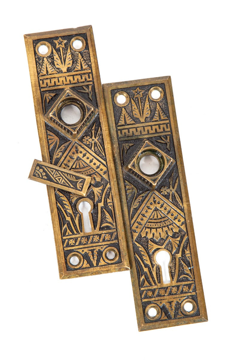 two original 1880s antique american ornamental cast brass interior residential "oriental" pattern eastlake doorknob backplates
