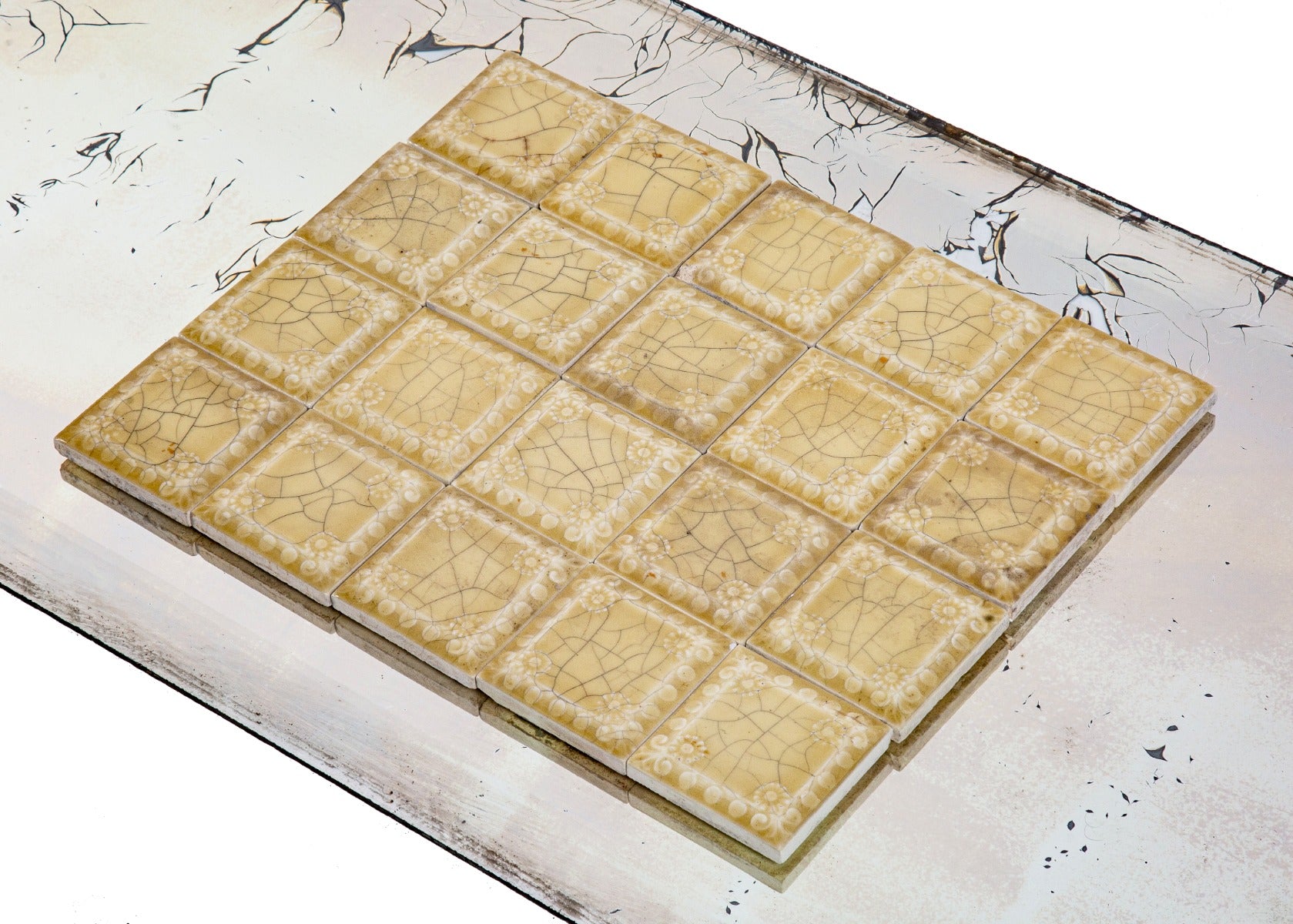 large lot of matching 3 x 3 inch butterscotch-colored salvaged chicago majolica fireplace tiles with floral pattern border