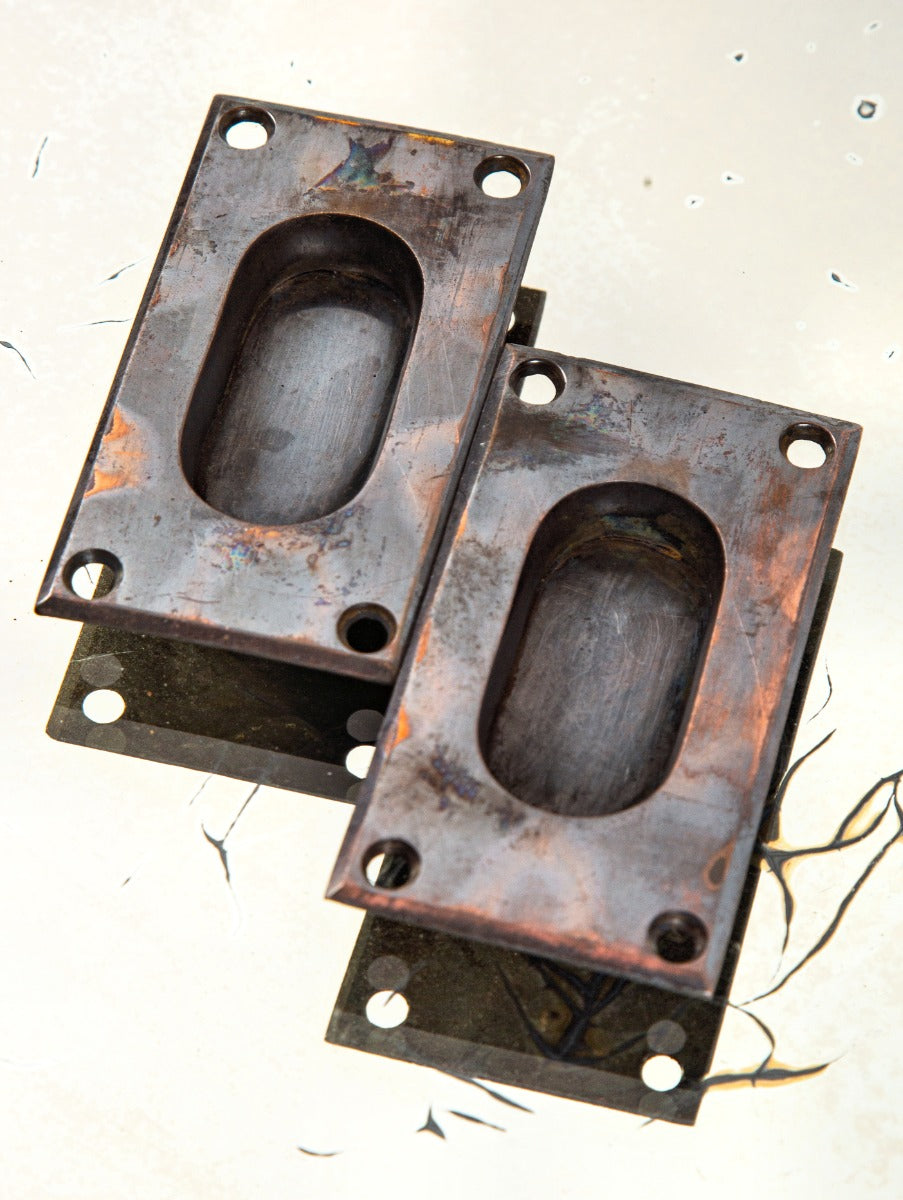 matching set of original hard to find late 19th century cast brass flush mount recessed cup handles with intact oxidized copper or "tiger stripe" finish