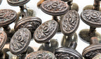 hard to find sizable lot of matching early 20th century antique american ornamental cast iron salvaged "arcadia" pattern oval-shaped doorknobs