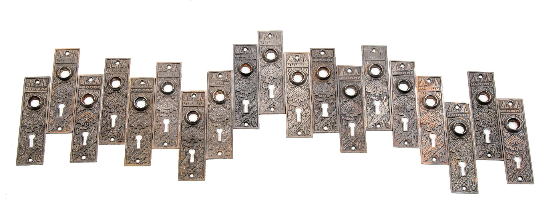 large lot of early 20th century antique american salvaged chicago "oriental" pattern ornamental cast iron doorknob backplates