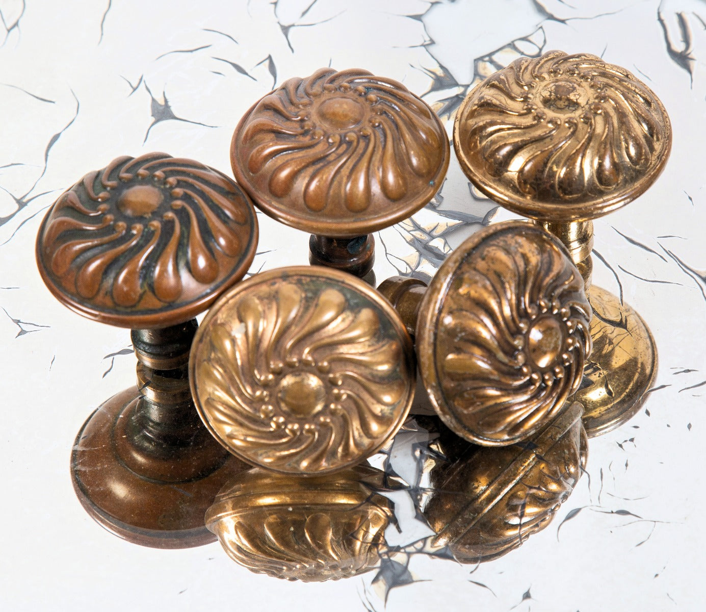 late 19th century antique american ornamental wrought brass "pinwheel" pattern salvaged chicago corbin doorknobs