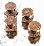 group of highly desirable antique american eastlake style ornamental cast bronze penn drum-shaped doorknobs and matching rosettes