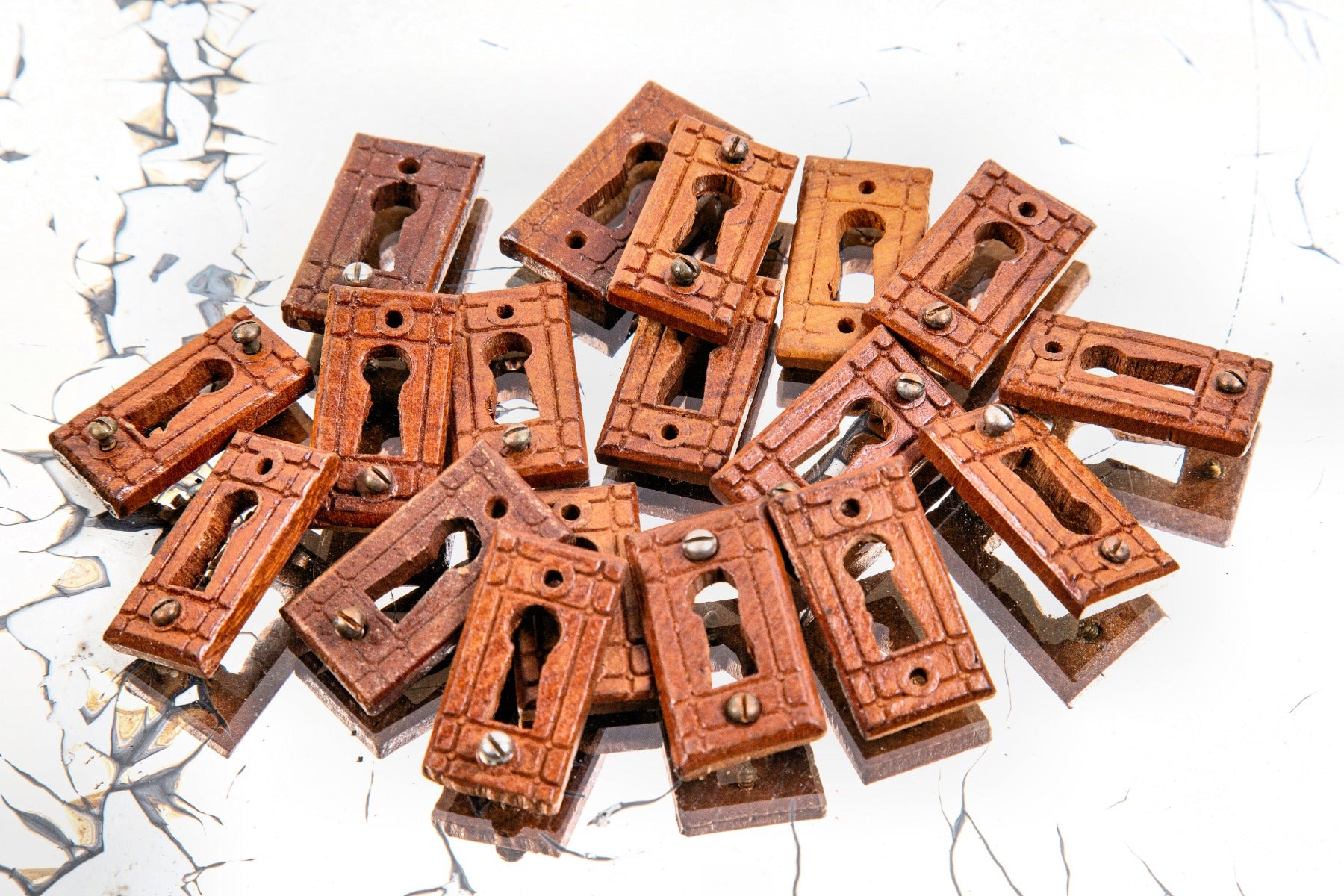 large lot of matching 1880s eastlake style solid cherry wood "new old stock" residential passage door keyhole escutcheons