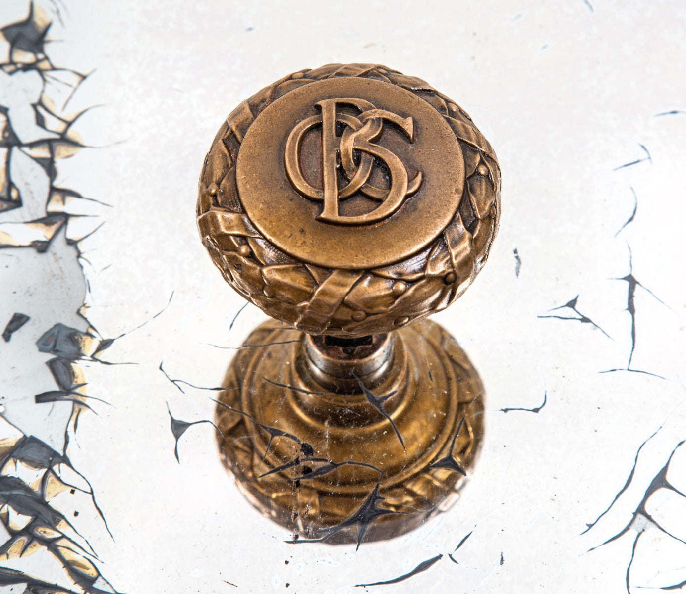 original late 19th century ornamental cast bronze monogrammed doorknob from holabird and roche's old colony building