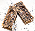 matching set of original ornamental cast bronze c. 1880's eastlake style "oriental" pattern branford pocket door escutcheons