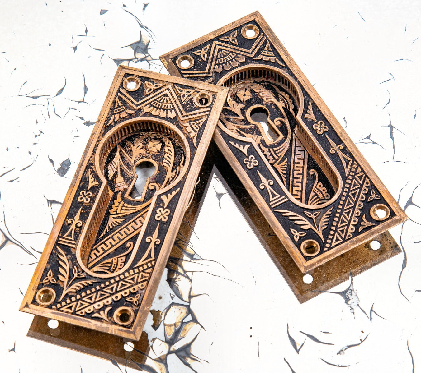 matching set of original ornamental cast bronze c. 1880's eastlake style "oriental" pattern branford pocket door escutcheons