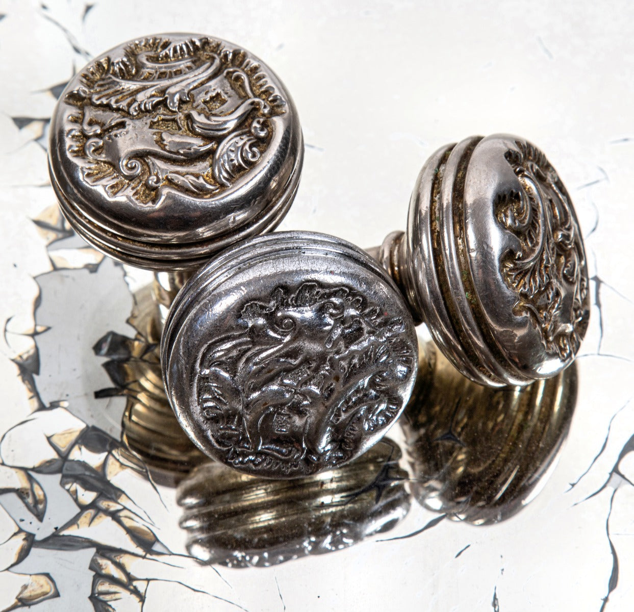 group of three matching late 19th century nickel and chrome-plated cast bronze "belforte" pattern passage door knobs
