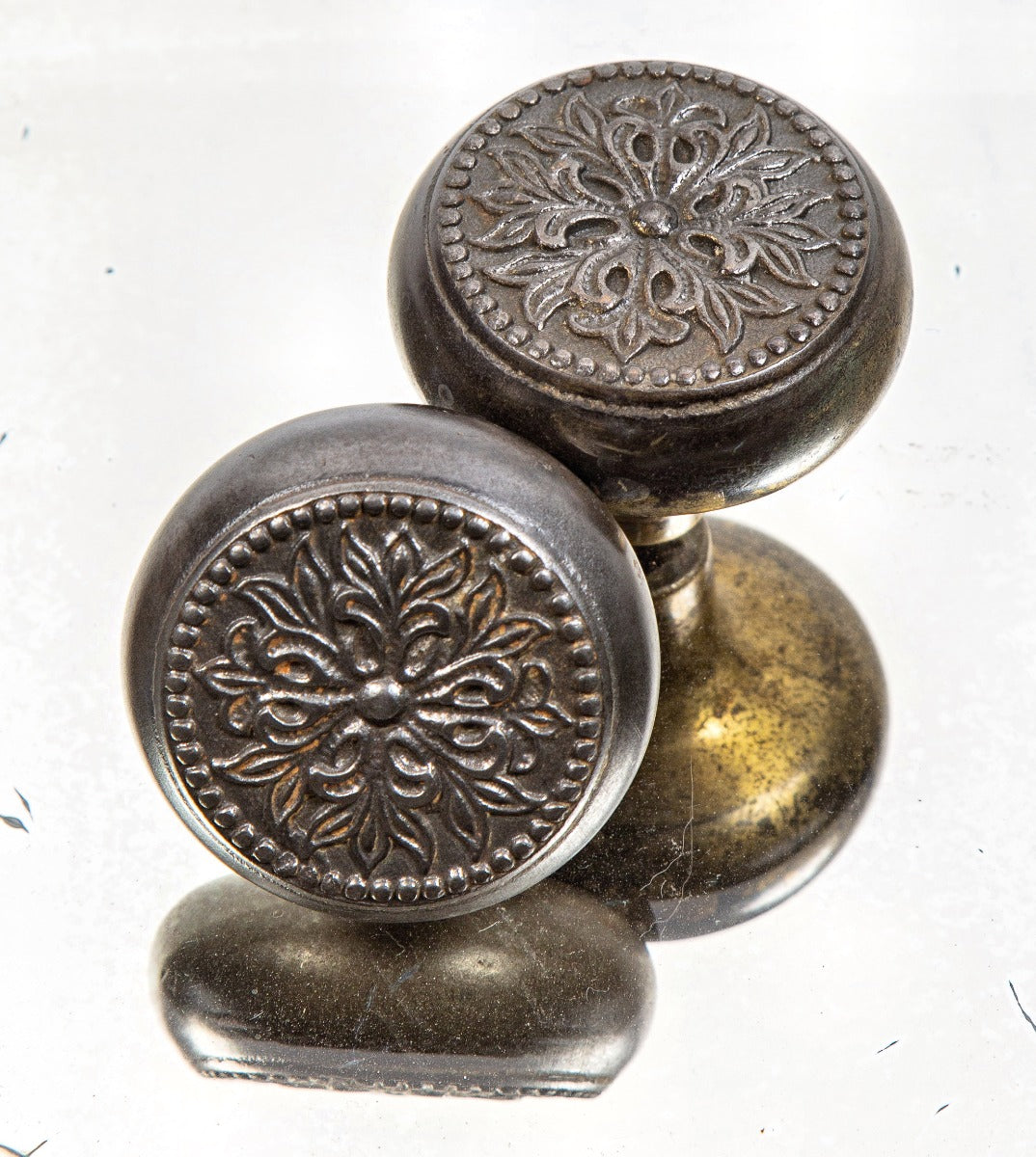 pair of early 20th century antique american "petunia" pattern ornamental cast iron salvaged chicago doorknobs
