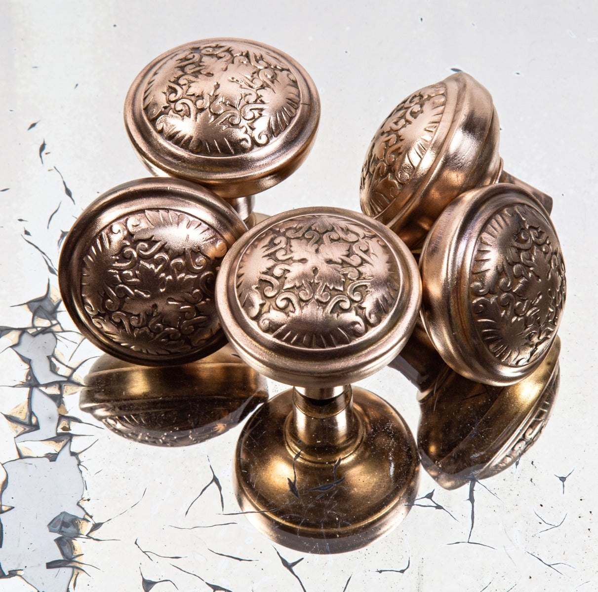 group of four matching wrought bronze "montello" pattern interior residential antique american residential doorknobs