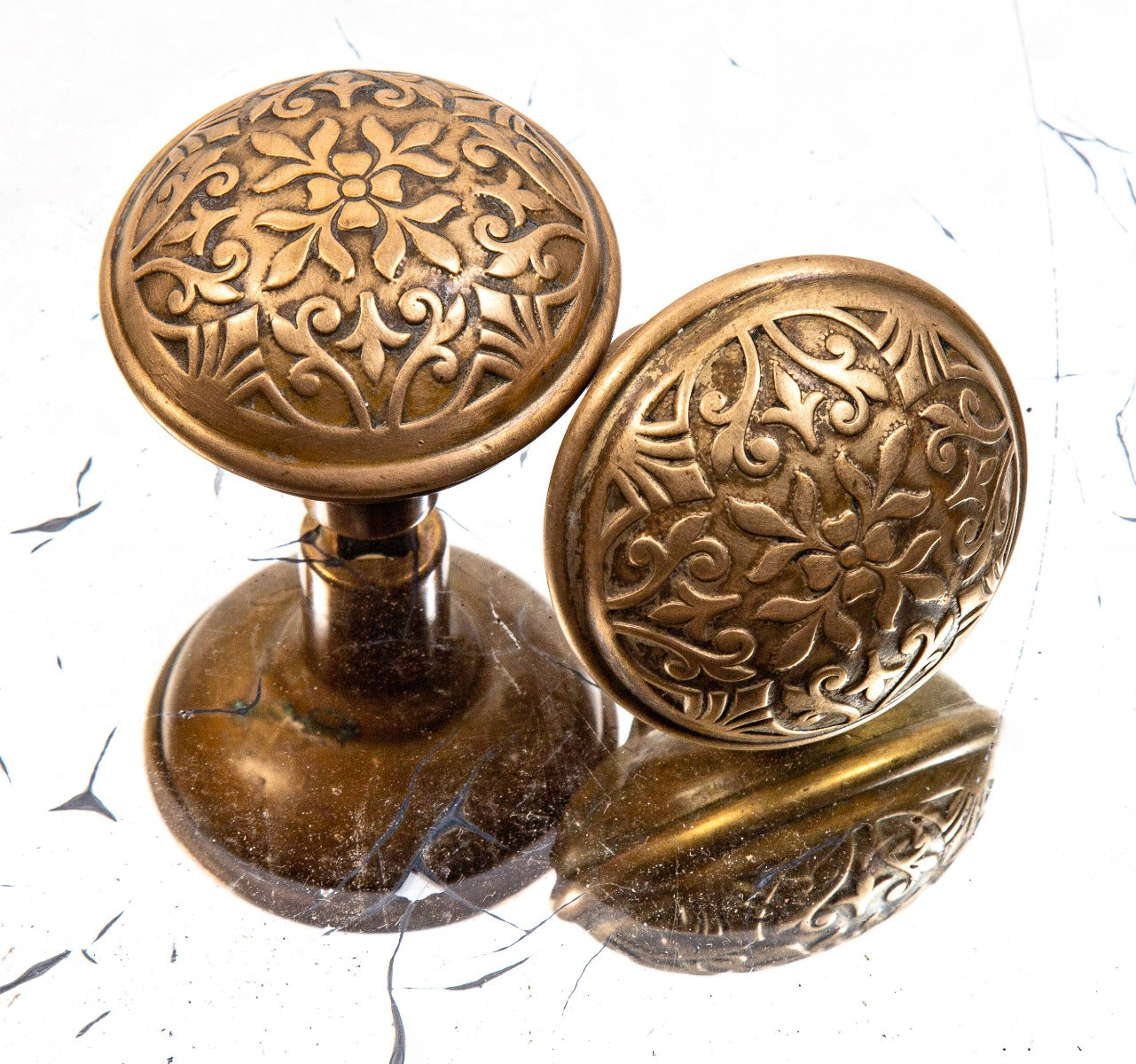 matching set of original "cairo" pattern ornamental wrought brass residential doorknobs fabricated by norwalk