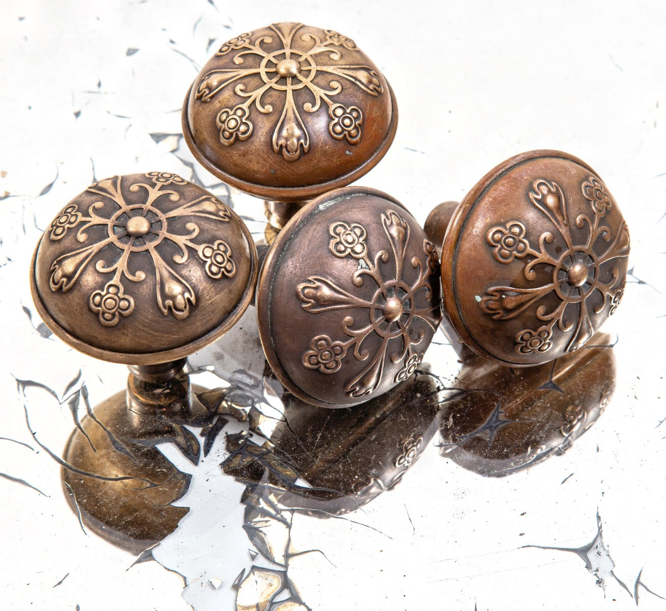 group of matching late 19th or early 20th century antique american ornamental wrought brass dome-shaped doorknobs