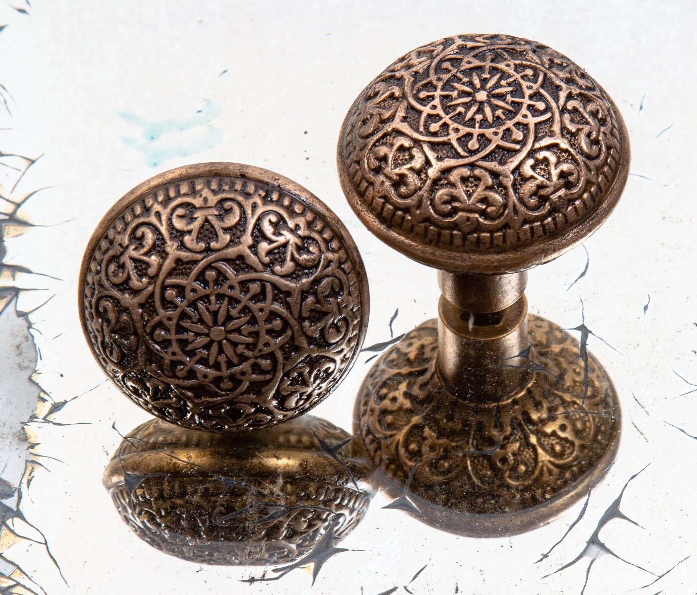 matching set of original 1870's heavily ornamented cast bronze dome-shaped high victorian-era cast bronze doorknobs