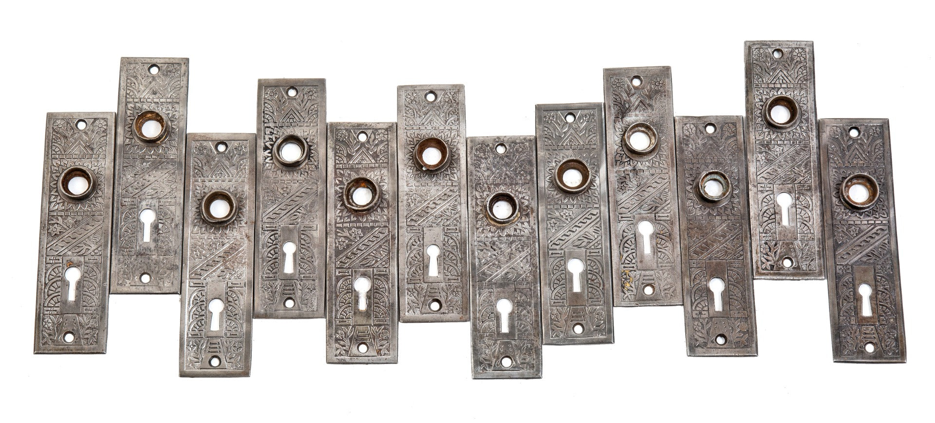group of 8 matching late 19th century antique american salvaged chicago "windsor" pattern wrought steel doorknob backplates