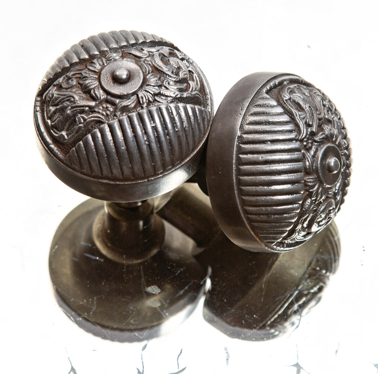 original and hard to find matching late 19th century ornamental cast iron "columbian" pattern salvaged chicago doorknobs
