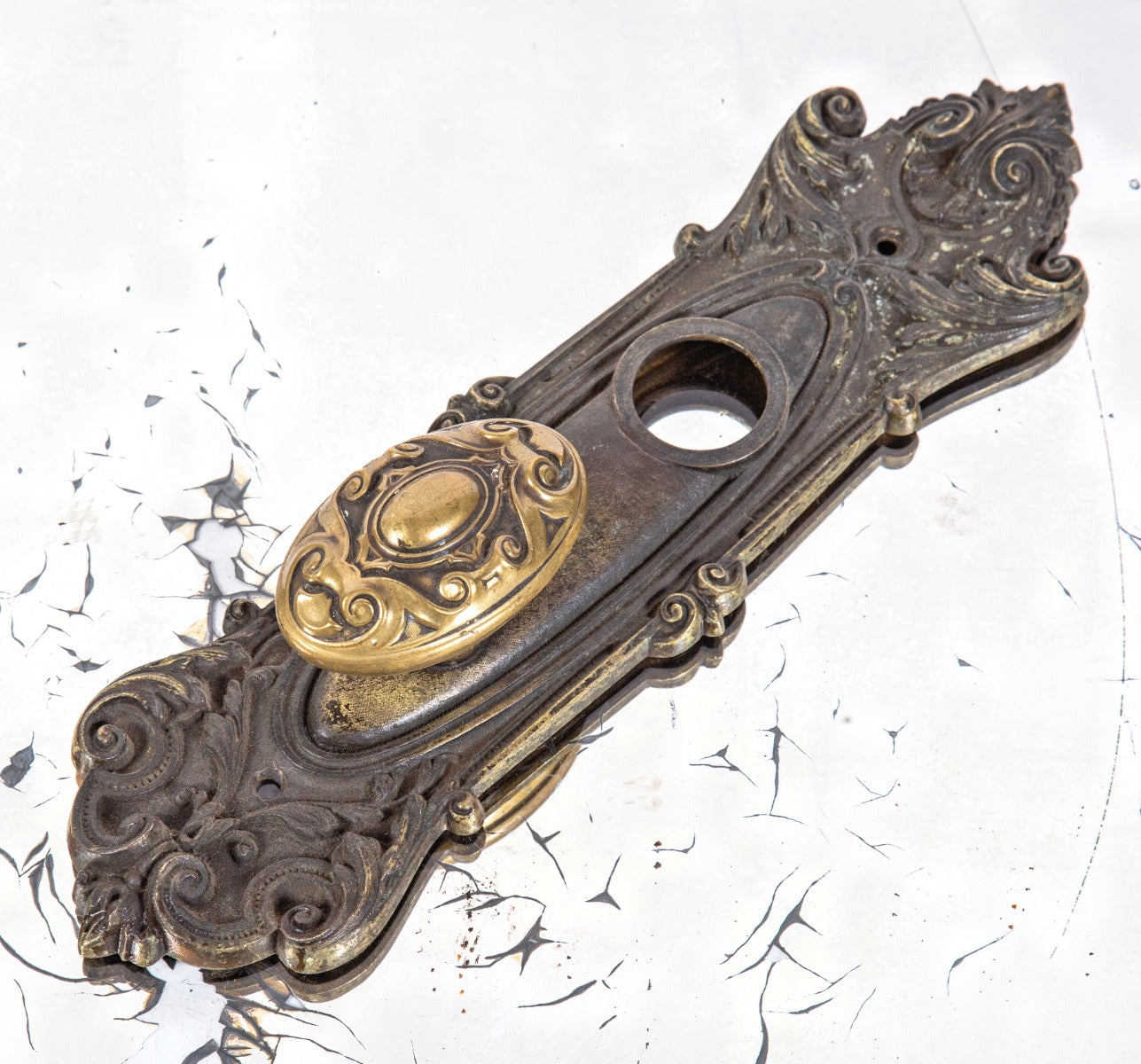 early 20th century salvaged chicago ornamental brass "meridian" pattern oval-shaped doorknob with entrance door backplate