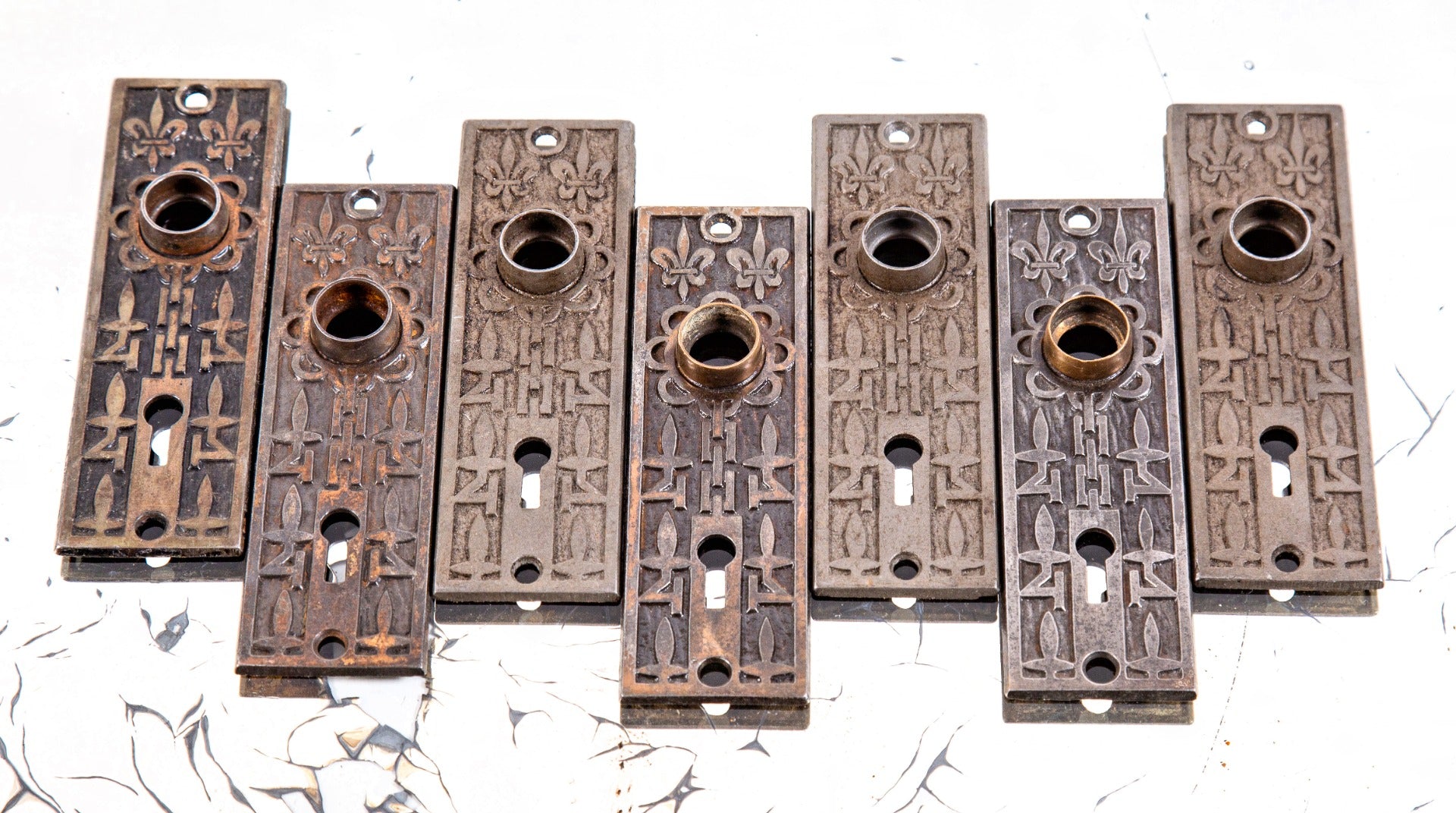 original late 19th century antique american ornamental cast iron "fleur-de-lis" pattern residential passage door backplates