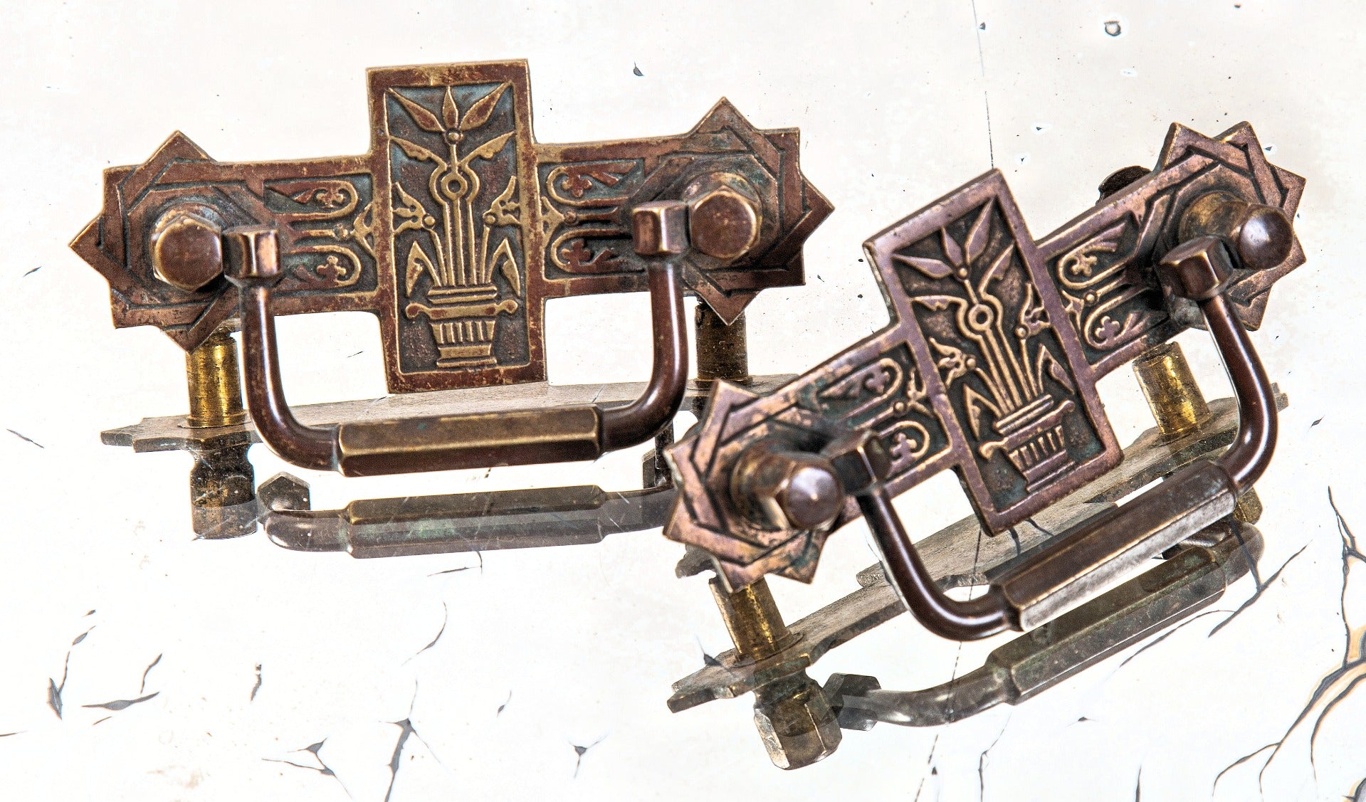 matching set of heavy cast brass american aesthetic interior residential drawer pulls with nicely aged patina