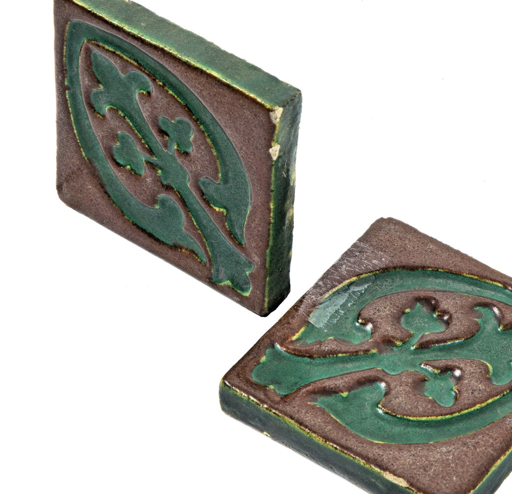 all original early 20th century matching new old stock ornamental matte glazed grueby faience tiles with distinctive "cucumber green" floral motif