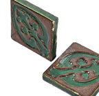 all original early 20th century matching new old stock ornamental matte glazed grueby faience tiles with distinctive "cucumber green" floral motif