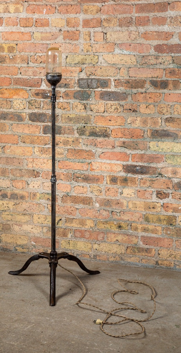 freestanding three-legged salvaged american theater stage "ghost light" with brushed cast iron and steel stand