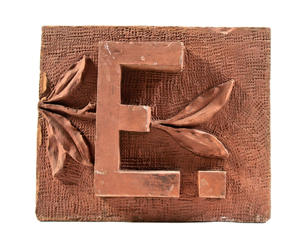 original red-slip glazed 1880s james higgie building terra cotta name panel with single block letter