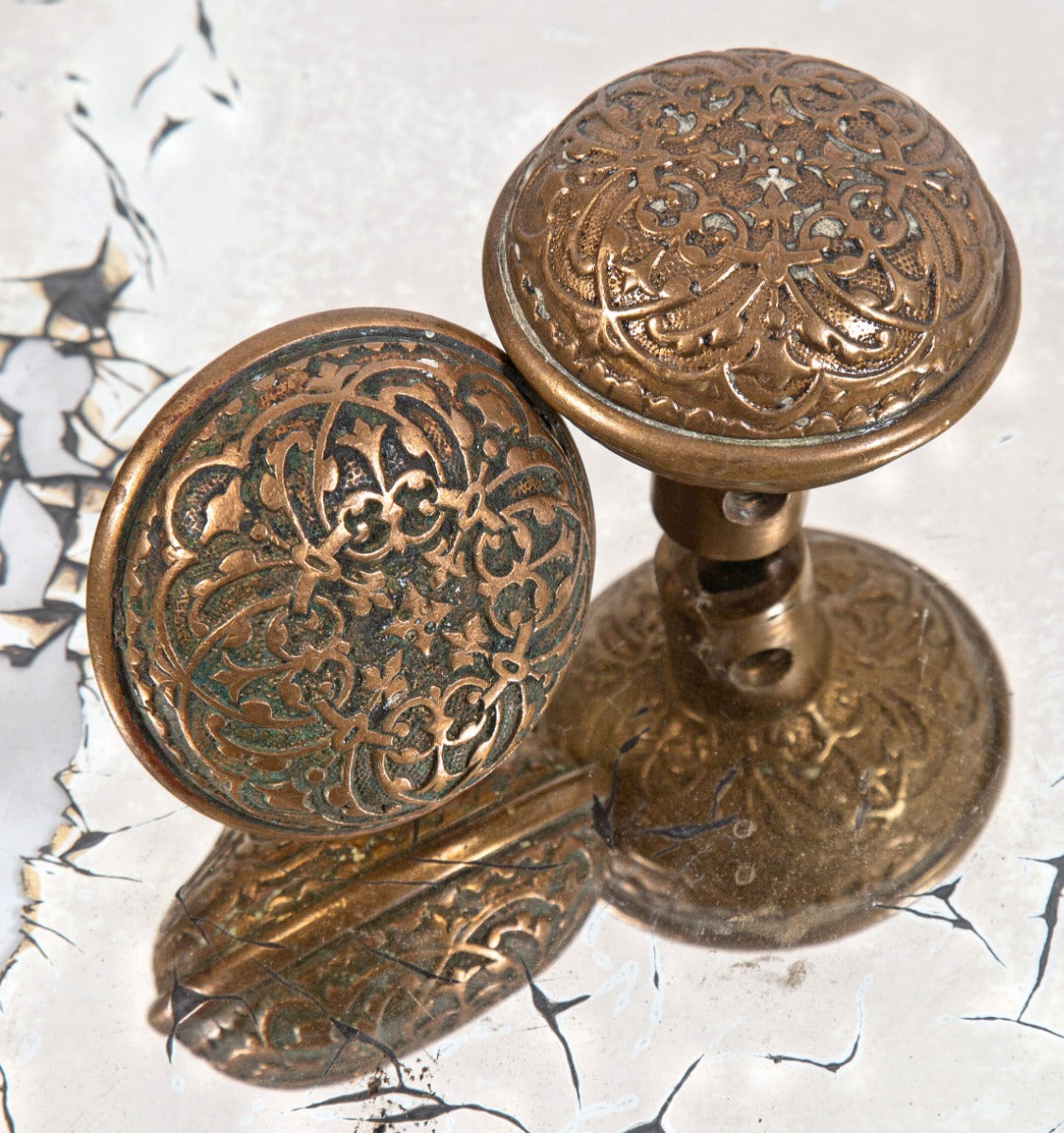 matching set of early 1880s ornamental cast bronze interior residential reading hardware company doorknobs with nicely aged patina