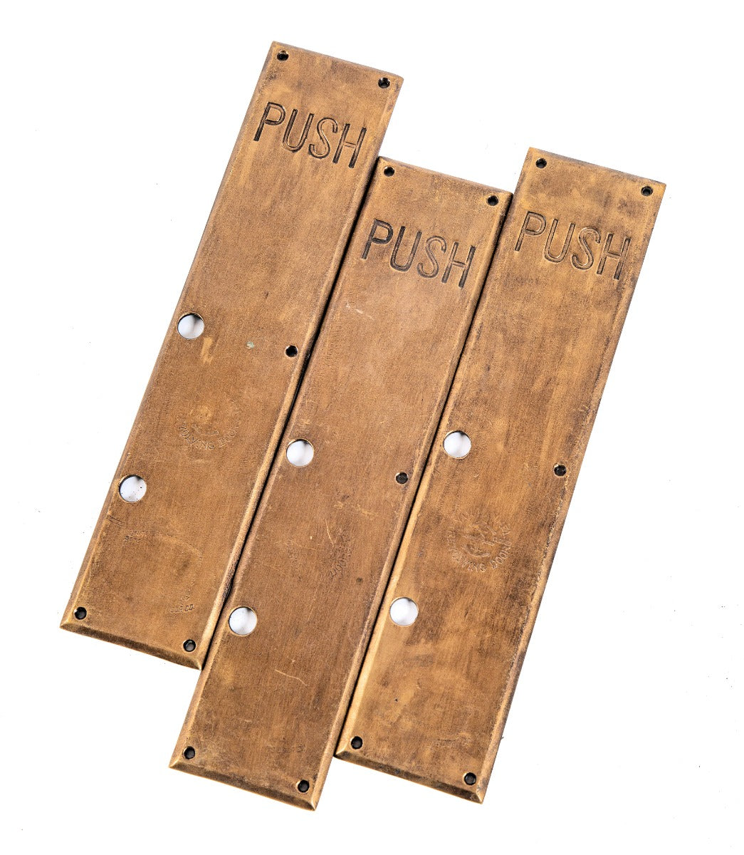 group of three matching original c. 1920 oversized cast bronze noel state bank revolving door push plates with oil-rubbed enameled finish