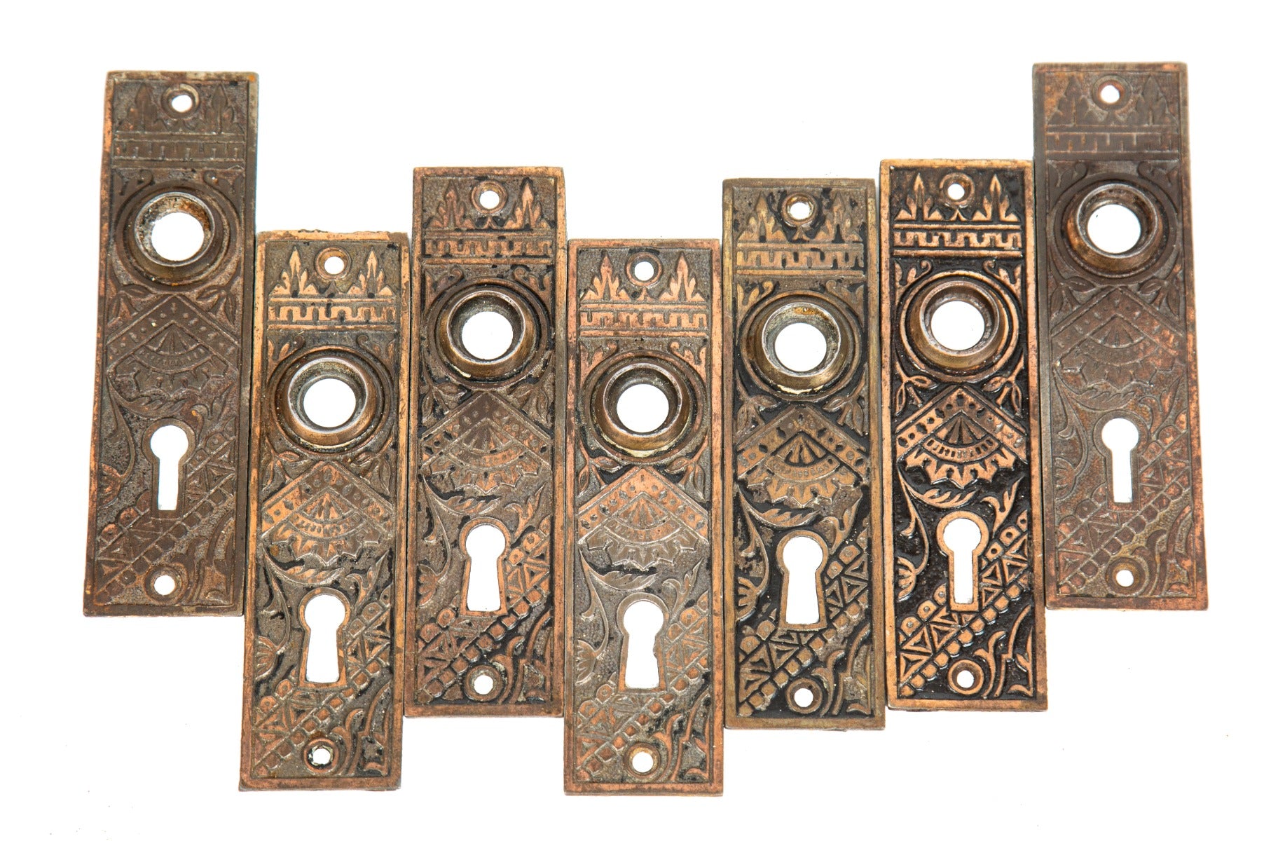 lot of seven matching 1880s original ornamental cast iron eastlake style "oriental" pattern interior residential doorknob backplates